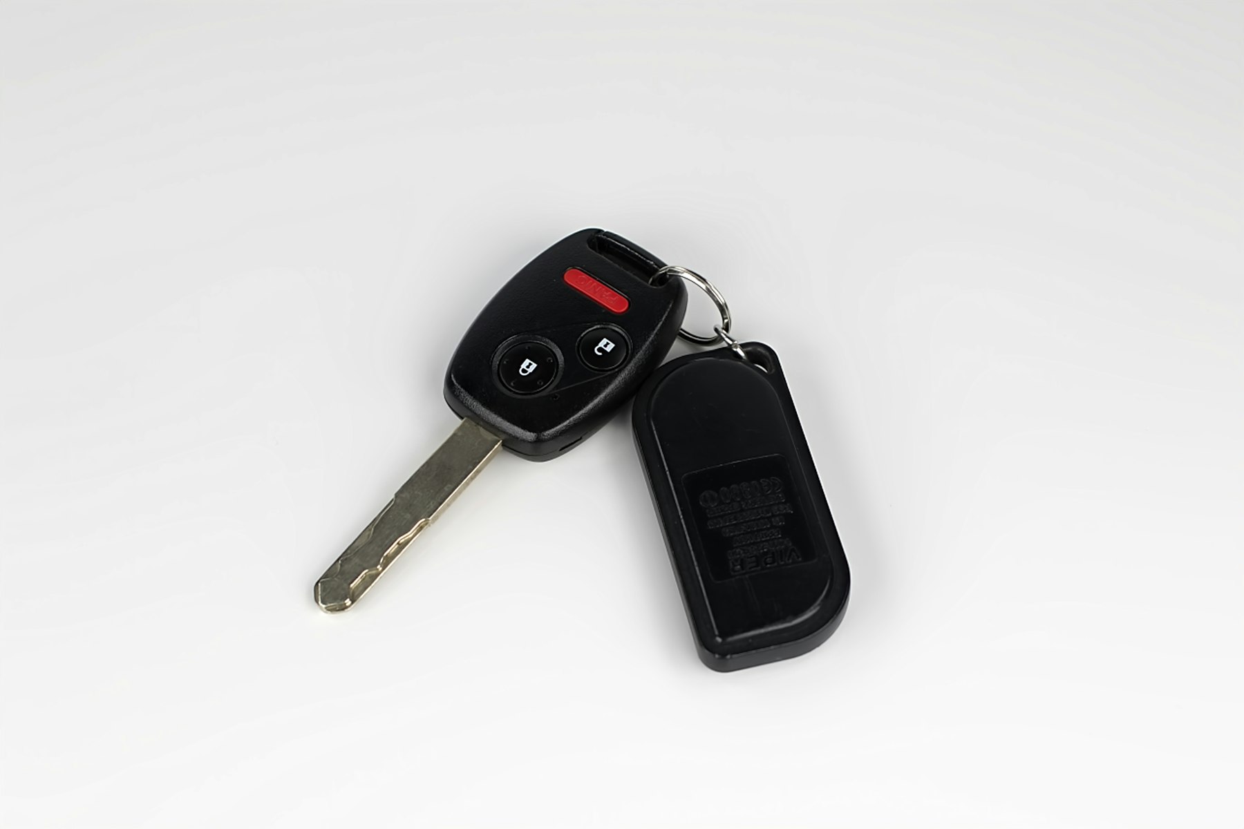 A car key with a remote fob attached